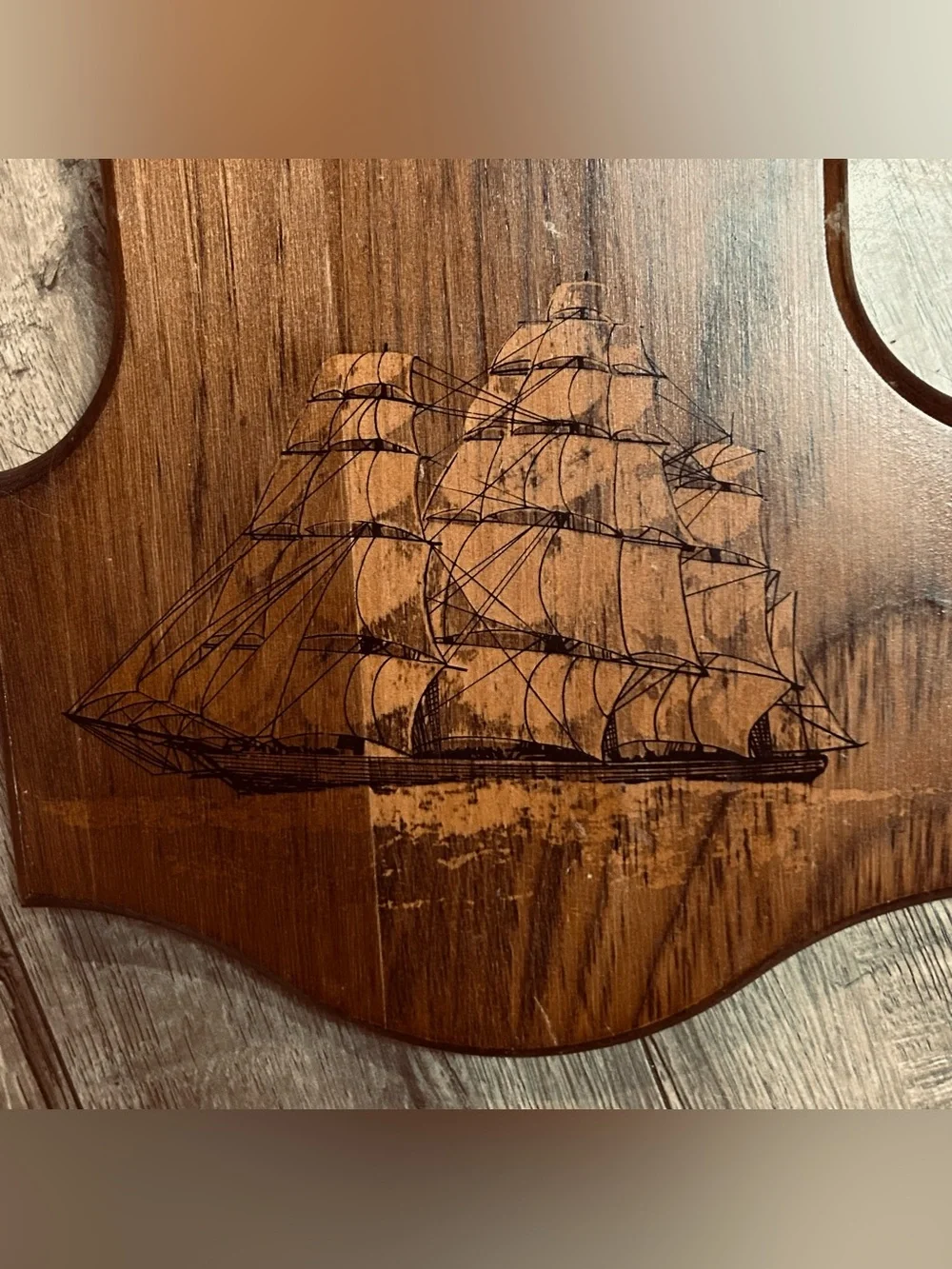 Bulova wall clock features a unique wooden casing shaped like a stylized ship